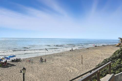 a beach with a group of people and the ocean at Solana Gem - Need to add in Solana Beach