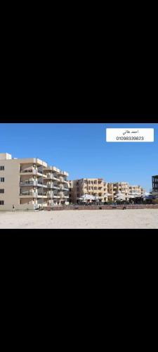 a television screen with a blue light in front of a building at Blubay VIP in Marsa Matruh