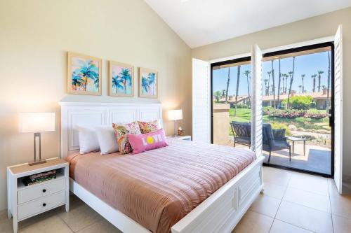 a bedroom with a bed and a sliding glass door at TWO Guest Suites ON Tee Box #2 Palm Valley Country Club with access to Tennis and Athletic Club Two on #2! in Palm Desert