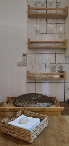 a room with wine glasses and baskets on shelves at Caribean Seascape in Villas del Mar