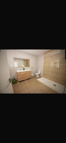 a bathroom with a sink and a toilet in a room at Casa Rural La Granja de Torrehermosa TR-BA-00291 in Granja de Torrehermosa