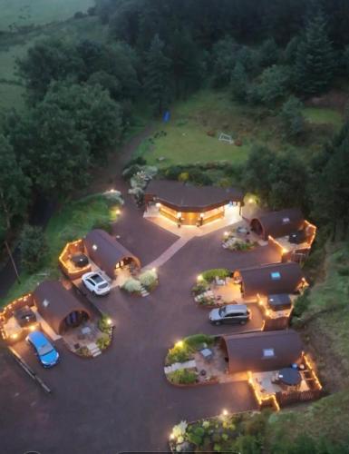 an aerial view of a parking lot at night at Gortin Glen Glamping in Omagh