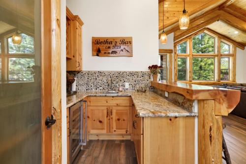 a kitchen with wooden cabinets and a counter top at Luxury Heavenly Lodge Big Bear~ Hot Tub + Pool Table in Big Bear Lake