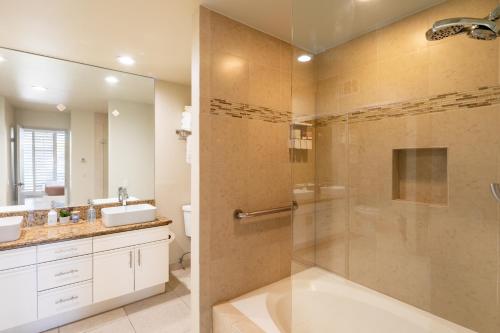 a bathroom with a shower with a glass door at TWO Guest Suites ON Tee Box #2 Palm Valley Country Club with access to Tennis and Athletic Club Two on #2! in Palm Desert