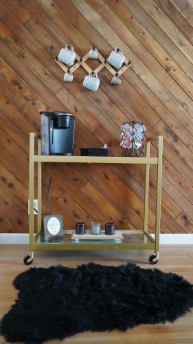 a shelf in a room with a wooden wall at Cozy chic farmhouse! Perfect for park explorers! in Fresno
