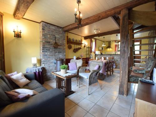 a living room with a couch and a table at Cozy Family Stay in Durbuy in Durbuy