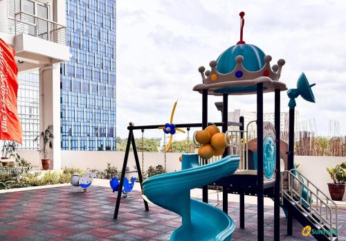 a childrens playground with a castle slide at Juvycondo in Davao City