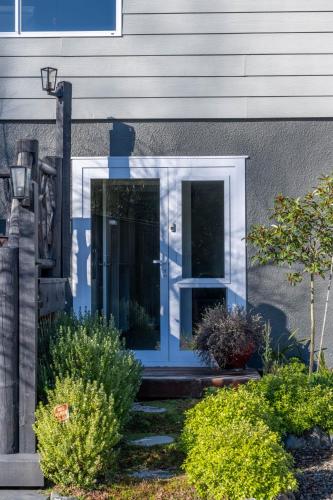 a blue door on the side of a house at Shiloh Luxury Retreat in Wakefield