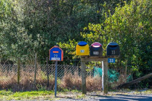 two parking meters on the side of a road at Shiloh Luxury Retreat in Wakefield