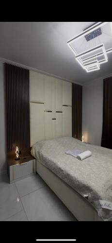 a bedroom with a bed and a ceiling at A-Frame Yaşam in İsmayıllı