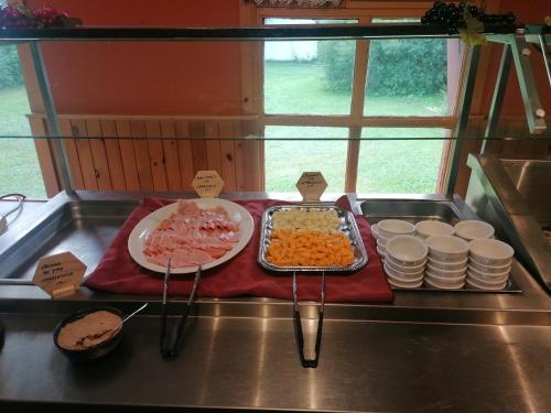 a buffet of food on top of a counter at Auberge La Coudriere (Cool Hotel) in L'Isle-aux-Coudres