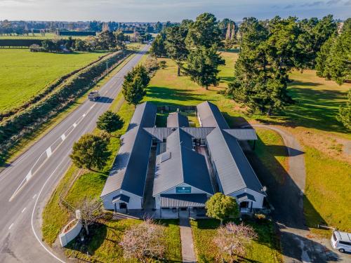 an overhead view of a house on a road at Harewood Lodge in Christchurch
