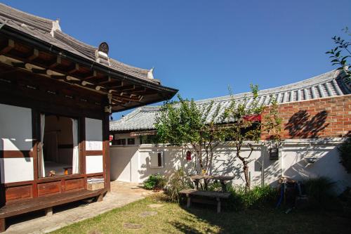 a building with a bench in front of it at Eosahwa in Jeonju