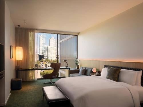 a hotel room with a bed and a large window at The Loren Hotel Austin in Austin