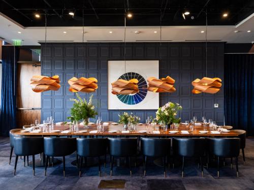 a large dining room with a long table and chairs at The Loren Hotel Austin in Austin