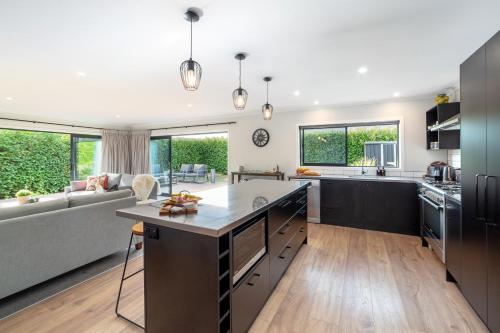 an open kitchen and living room with a couch at Forty-Five in Martinborough 
