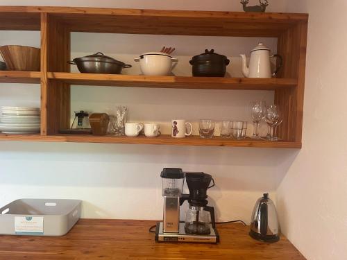 a kitchen with a coffee maker on a counter at Fuku Chalet in Hakuba