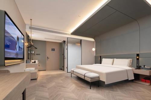 Postel nebo postele na pokoji v ubytování Atour Hotel Hubei Provincial Museum East Lake