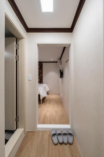 a room with a view of a bedroom at Life in Cheonggye in Seoul