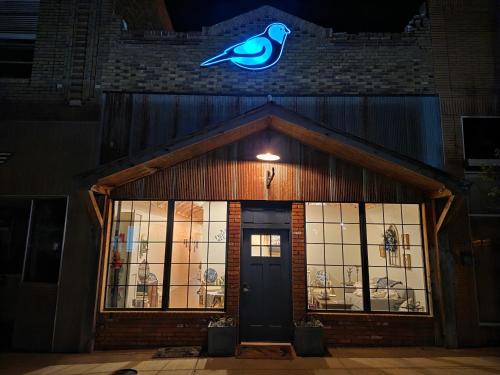 a building with a blue bird on the top of it at Bluebird in Elk City
