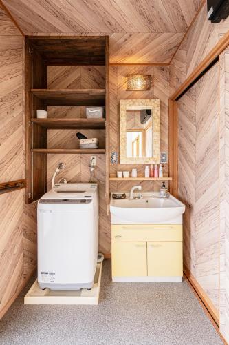 a bathroom with a toilet and a sink at Imazu Garden House in Fukuoka