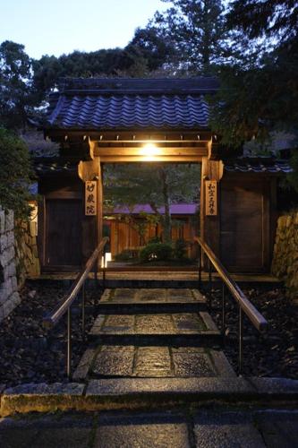 a pathway leading to a building with a gate at Temple-stay WAQOO Mii-dera Vacation STAY 7051 in Otsu