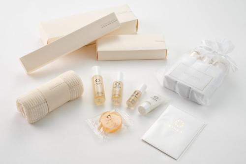 a pile of gift boxes and products on a table at Temple-stay WAQOO Mii-dera Vacation STAY 7053 in Otsu
