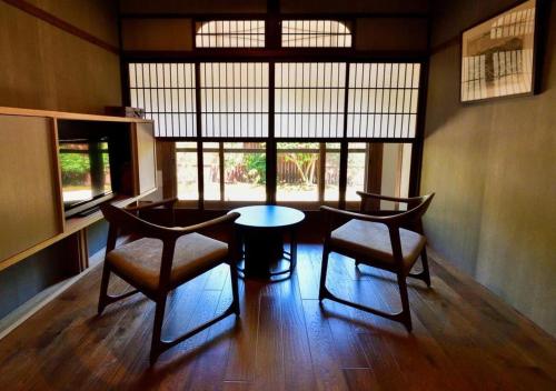 a dining room with a table and two chairs at Temple-stay WAQOO Mii-dera Vacation STAY 7052 in Otsu