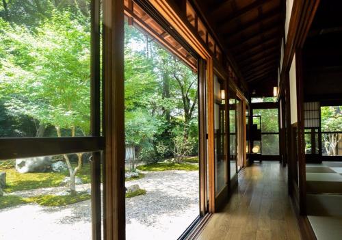 an open doorway to a house with a large window at Temple-stay WAQOO Mii-dera Vacation STAY 7053 in Otsu