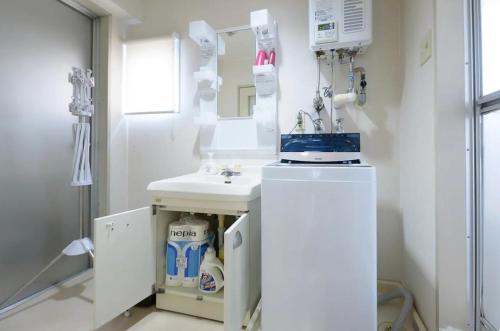 a bathroom with a sink and a mirror at Dynasty Palace Nijyuuyonken / Vacation STAY 7377 in Sapporo
