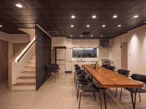 a kitchen and dining room with a table and chairs at 1-21-19 / Vacation STAY 80184 in Urasoe