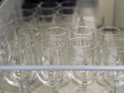 a bunch of wine glasses sitting on a table at 1-21-19 / Vacation STAY 80184 in Urasoe