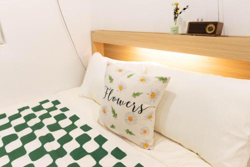 Ένα ή περισσότερα κρεβάτια σε δωμάτιο στο Lumiere h Hotel