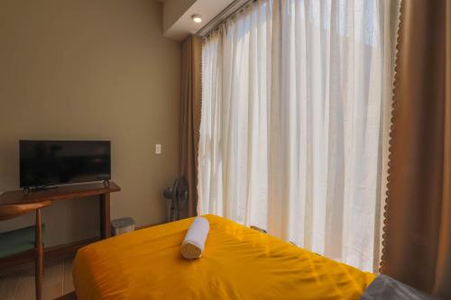 TV a/nebo společenská místnost v ubytování Vừng Hotel