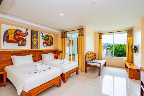 Ένα ή περισσότερα κρεβάτια σε δωμάτιο στο The Cheetar Hotel