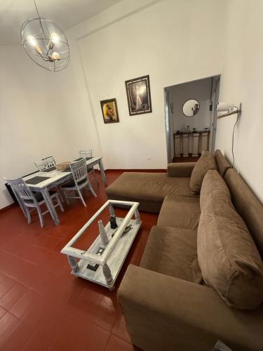 a living room with a couch and a table at Departamento en Salta Capital in Salta