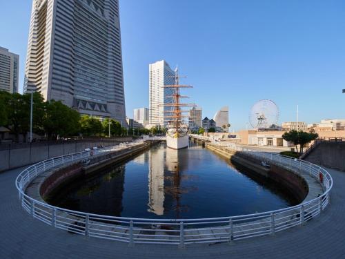 a river in the middle of a city with tall buildings at RetroSpect Stay Yokohama - Vacation STAY 03277v in Yokohama
