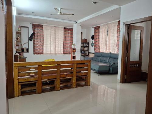 a living room with a couch at Shepherd Stories - Community stay for Social Entrepreneurs in Hyderabad