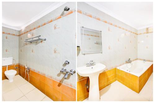 a bathroom with a sink and a toilet at Hotel O Rayagada Downtown in Rāyagada