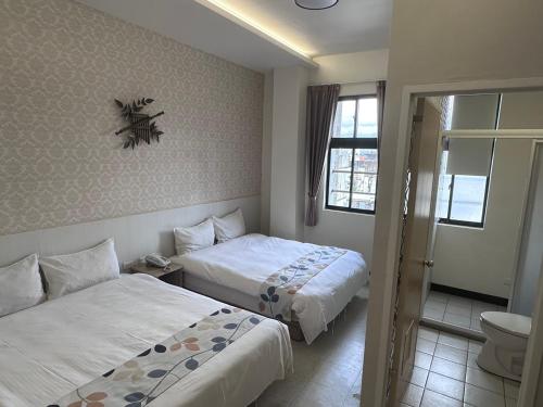 Katil atau katil-katil dalam bilik di Jia-Jia Business Hotel