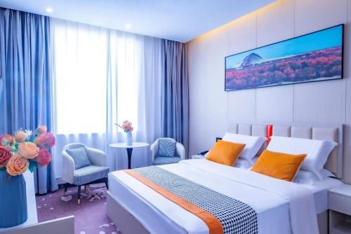 Postel nebo postele na pokoji v ubytování Xingang International Hotel