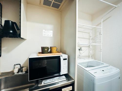 Kuchyň nebo kuchyňský kout v ubytování sakura 206