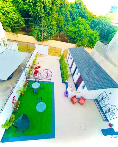 an aerial view of a patio with tables and chairs at Grand Villa in Amritsar