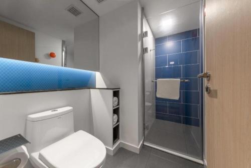 a bathroom with a toilet and a shower at Holiday Inn Express Guiyang Century City Mall By IHG in Guiyang