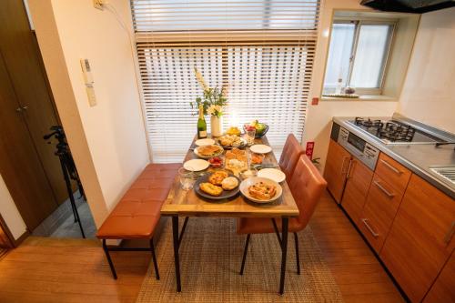 a table with plates of food on it in a kitchen at Scent of Asia in Yokohama