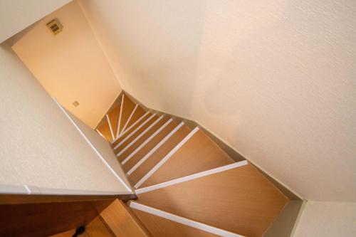 a staircase in a room with a stair case at Scent of Asia in Yokohama