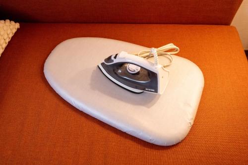 a white heart with a camera on top of it at Scent of Asia in Yokohama