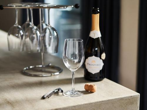 a bottle of champagne and a wine glass on a counter at Rakuten STAY VILLA Awaji 104 4 double beds, capacity of 8 persons in Minamiawaji