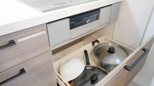 a small kitchen with a sink and a bowl at Grande Ortho Okinawa Villa Onna 3 - Vacation STAY 83617 in Onna