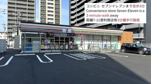 a car parked in a parking lot in front of a building at Kumamoto - House - Vacation STAY 83489 in Kumamoto